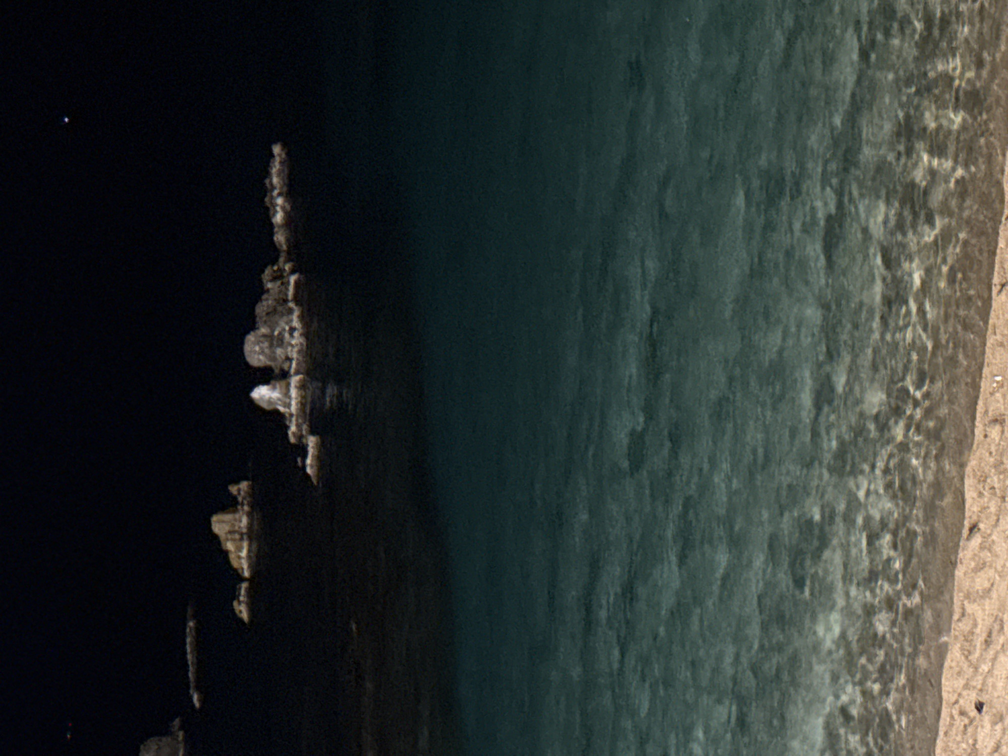 Nighttime coastal scenes captured in Blanes, Spain waterfront