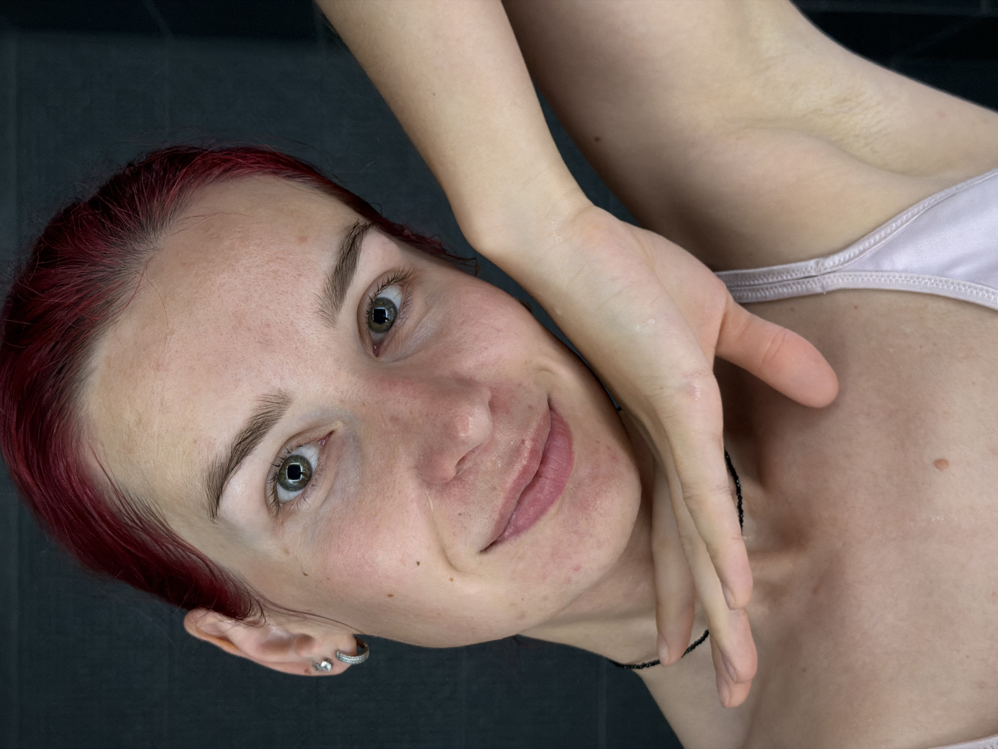 Woman documents morning skincare routine in Chaikovsky bathroom selfies