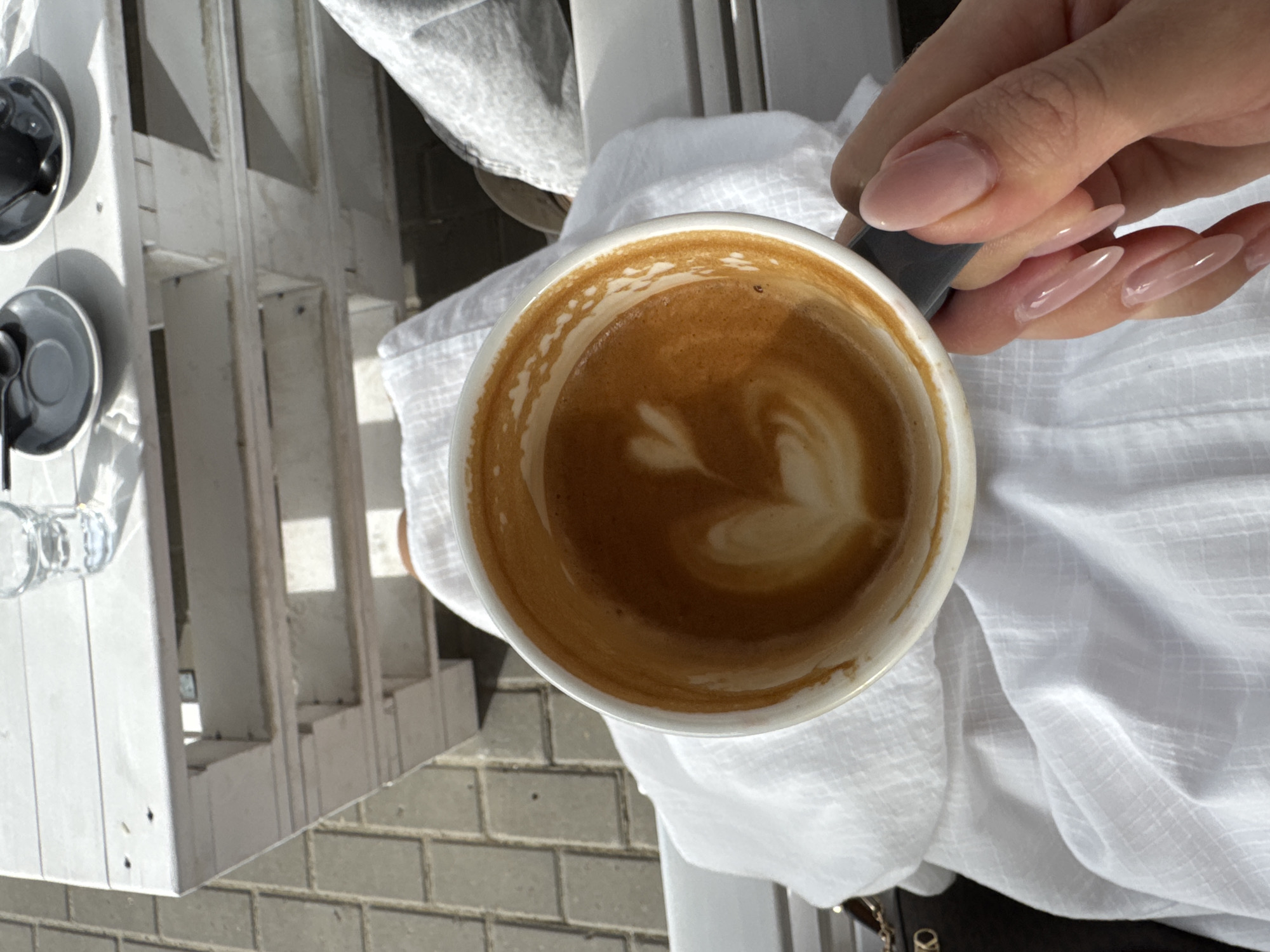 Coffee break captured at urban outdoor cafe