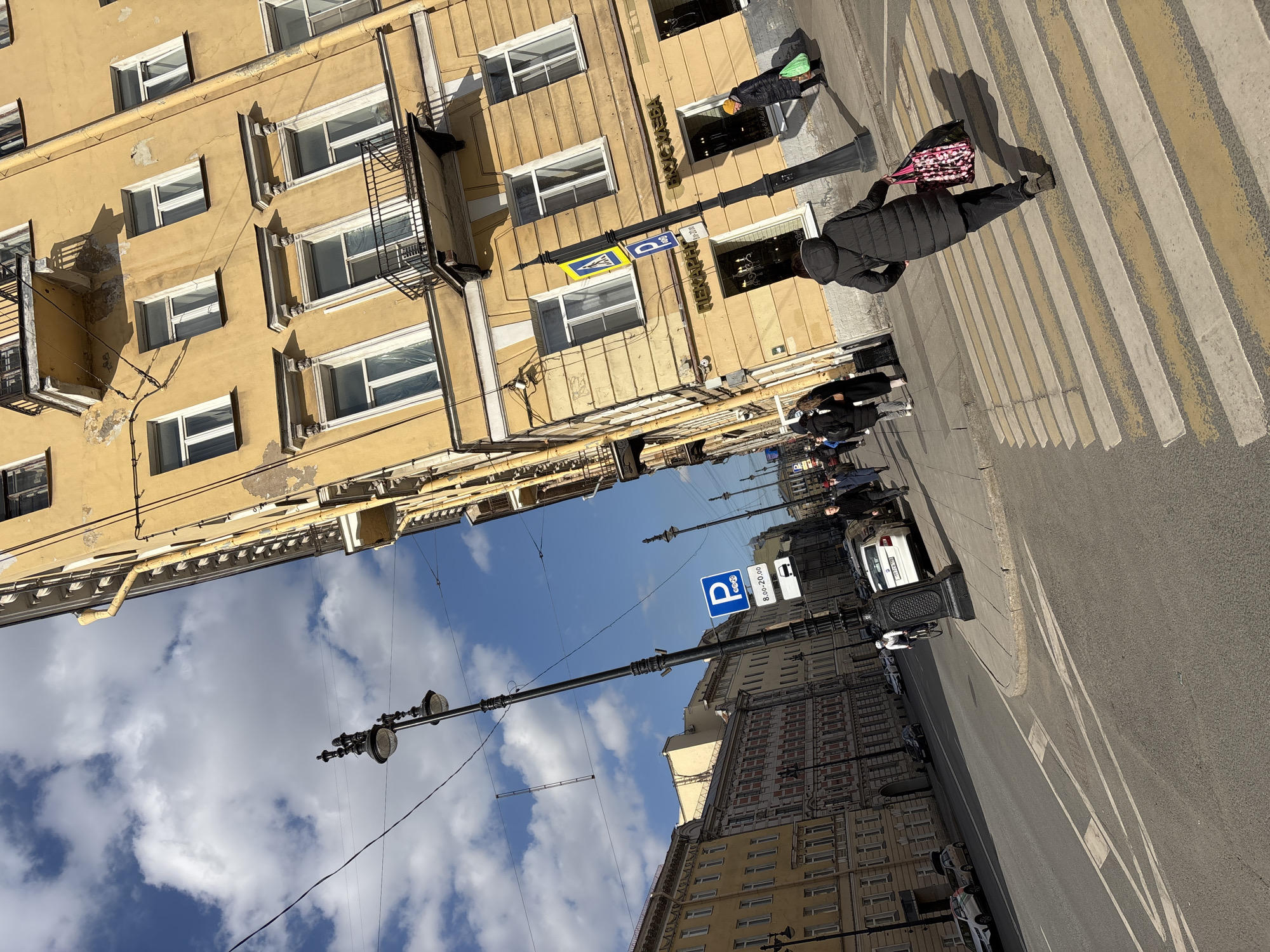 Tourist documents central Saint Petersburg landmarks during morning walkabout