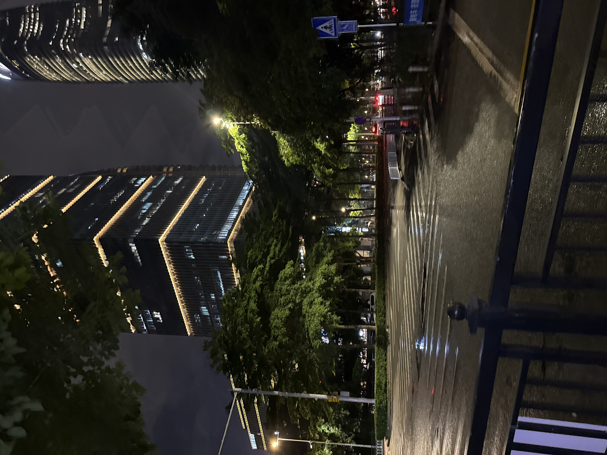 Rainy night on the neon-lit streets of Haizhu District