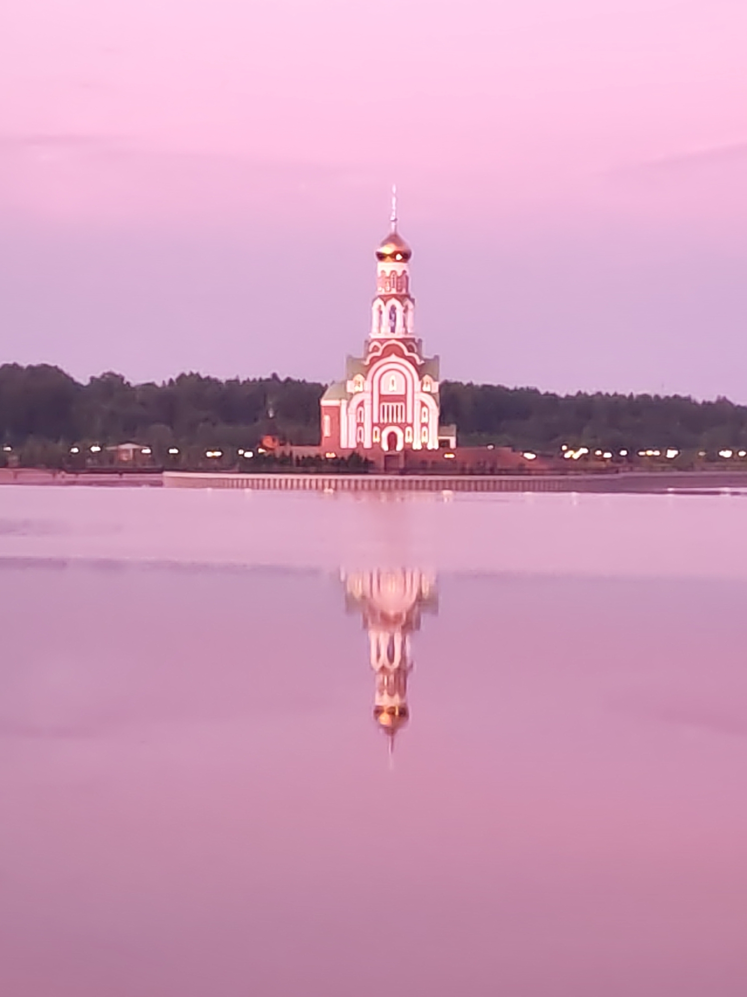 Orthodox church and cargo ship observed in Sverdlovo riverfront