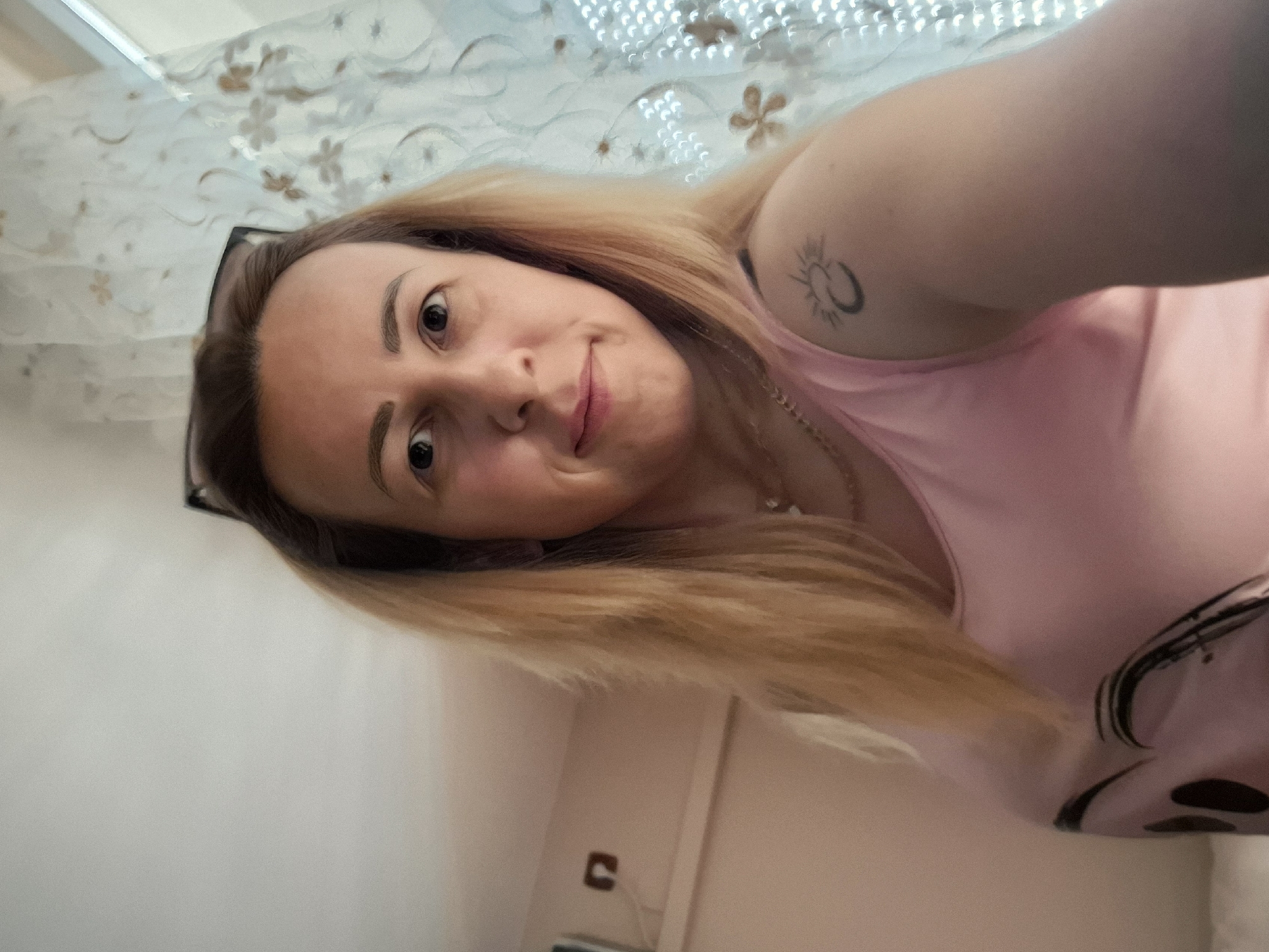 Woman photographed in indoor selfie and outdoor portrait session