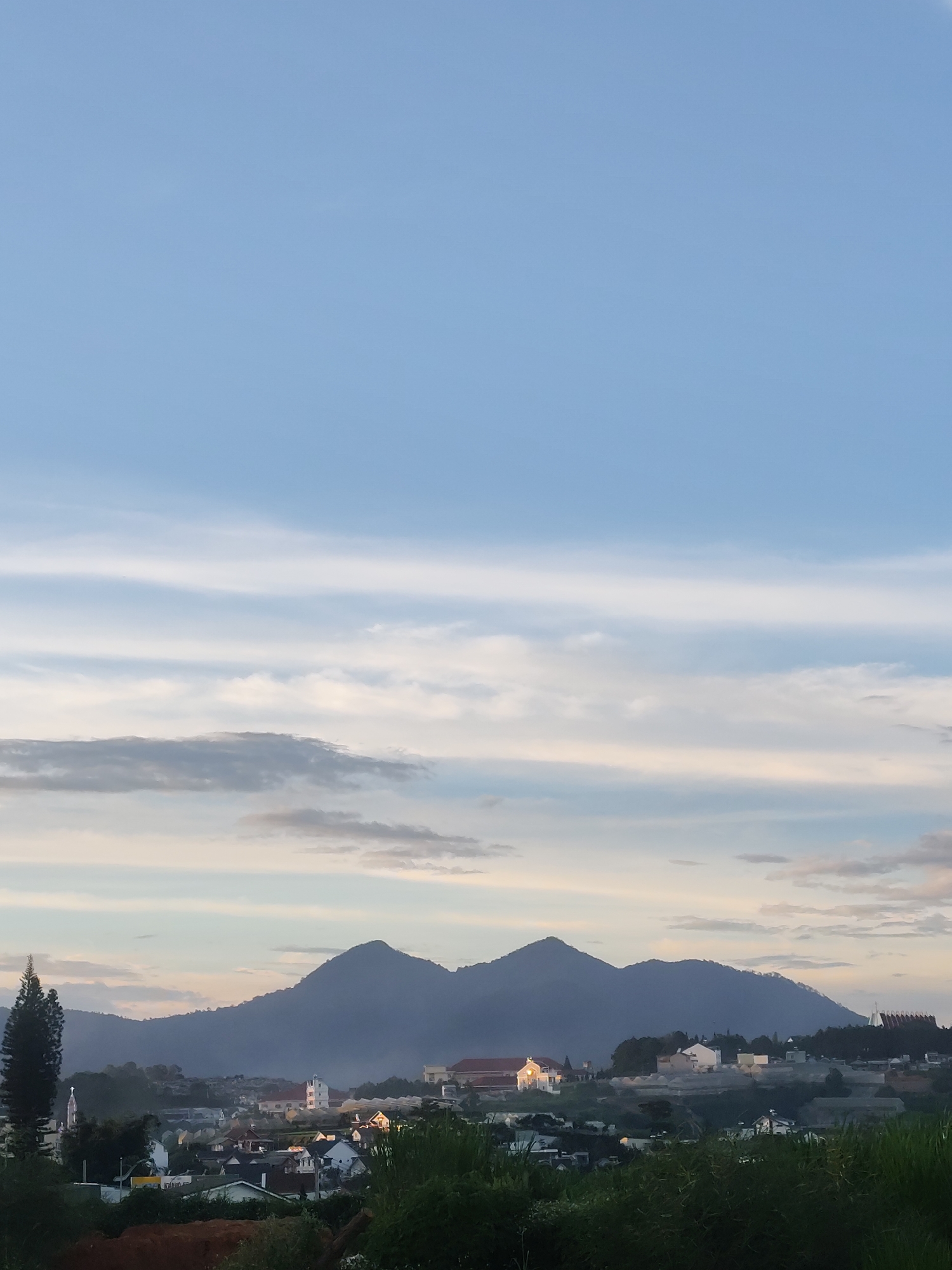 Kite flying over Da Lat's hills on a clear morning
