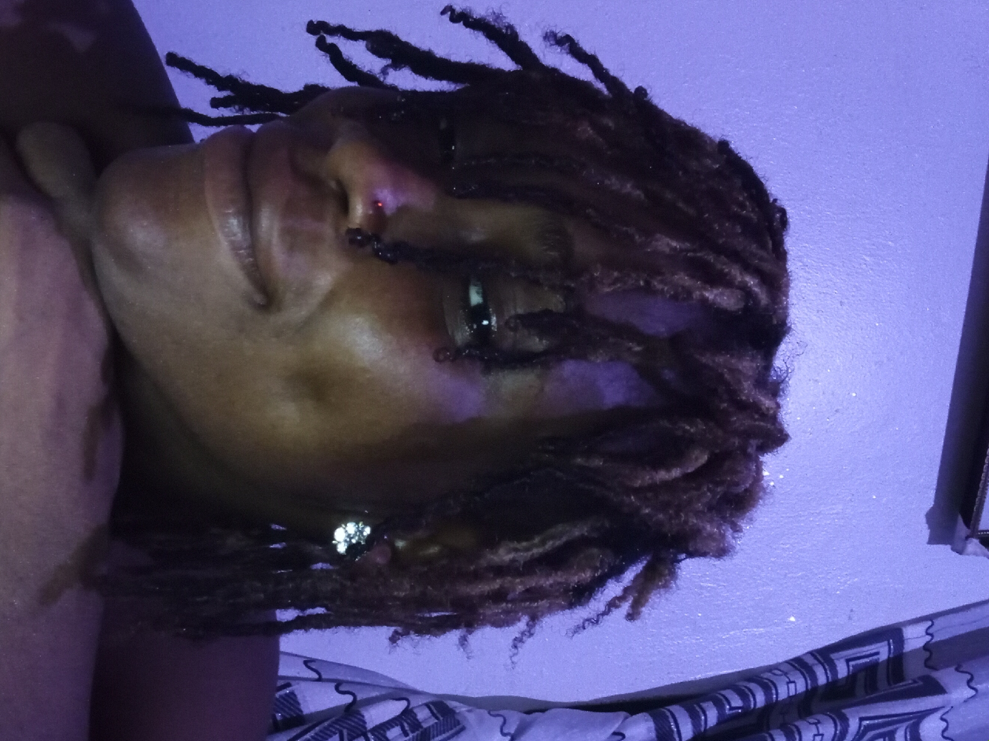 Person poses for indoor photo session in Shagamu