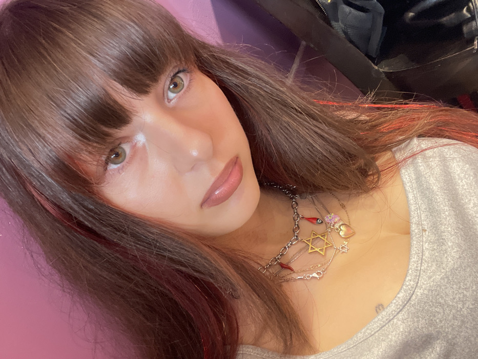 Woman documents afternoon shopping trip with selfies in Raanana