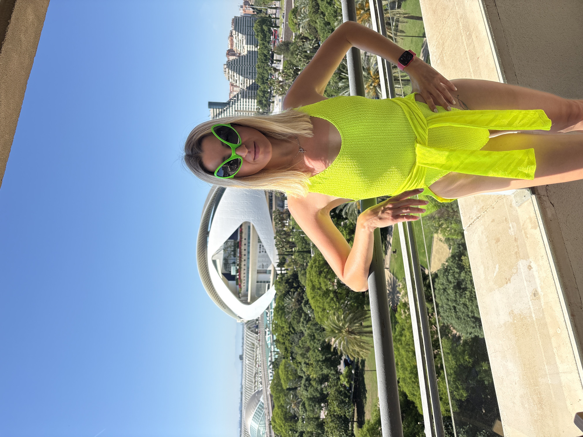 Woman poses in neon green at València's Arts complex