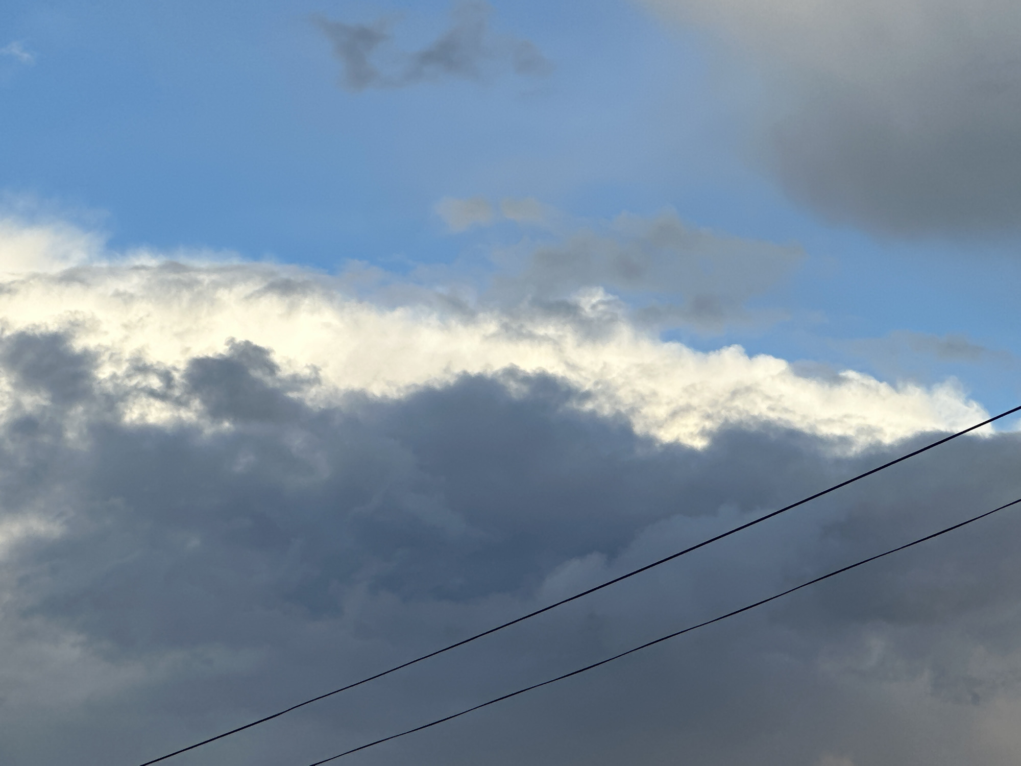 Urban afternoon captured: stormy skies, rainbow, apartment life, soccer broadcast