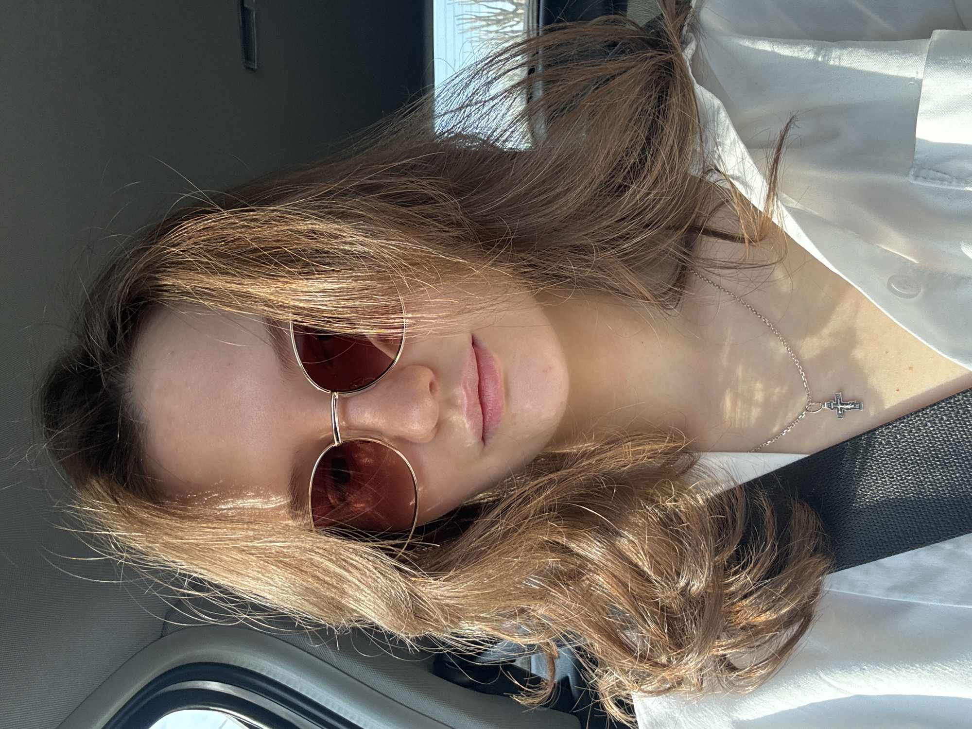 Woman in white shirt observed in vehicle in Perm