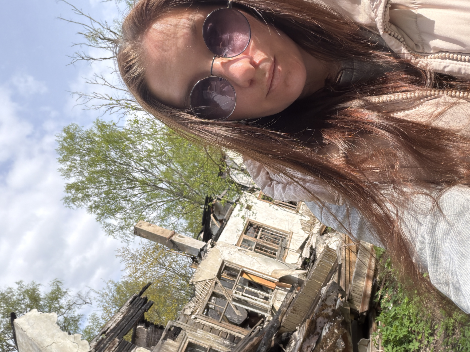 Woman photographs herself outdoors in Tokkari, Russia