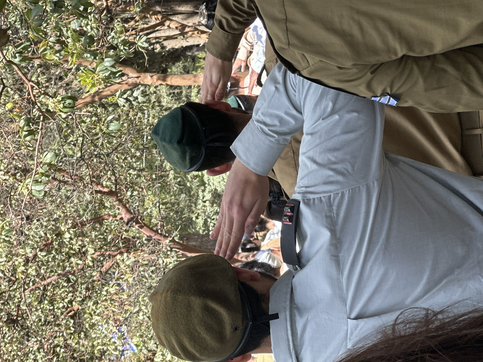 Solemn outdoor gathering observed from above in Jerusalem