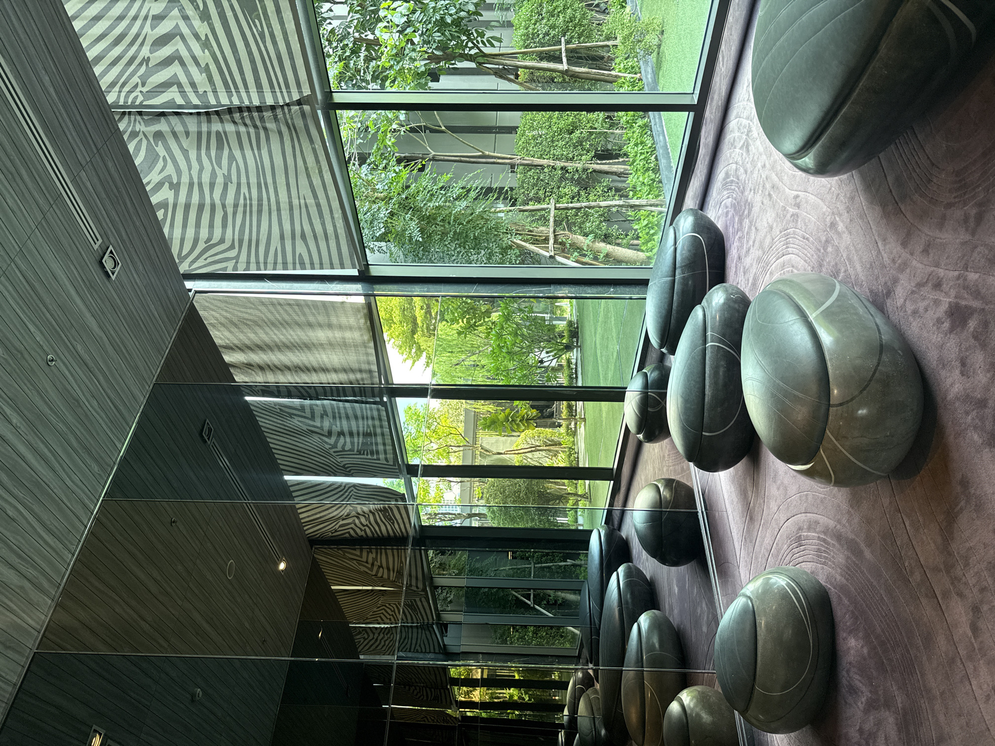 Modern Bangkok building interior features distinctive gray spherical objects