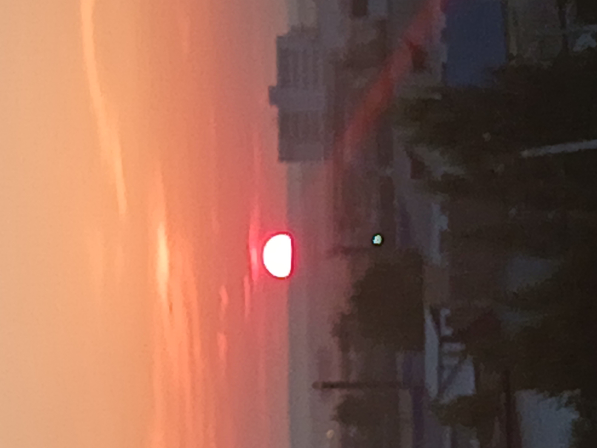 Sunset over Makinsk, Kazakhstan, in warm orange and red tones