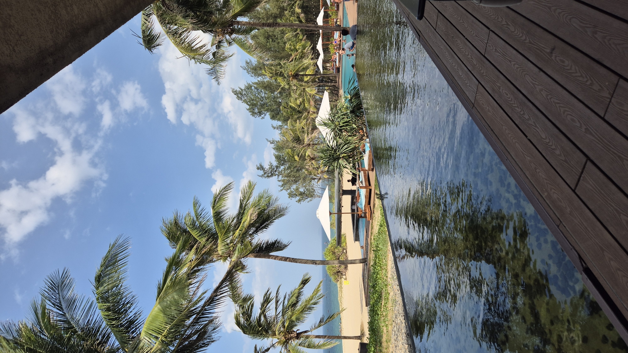 Beachfront resort pool on a sunny day in Hoi An