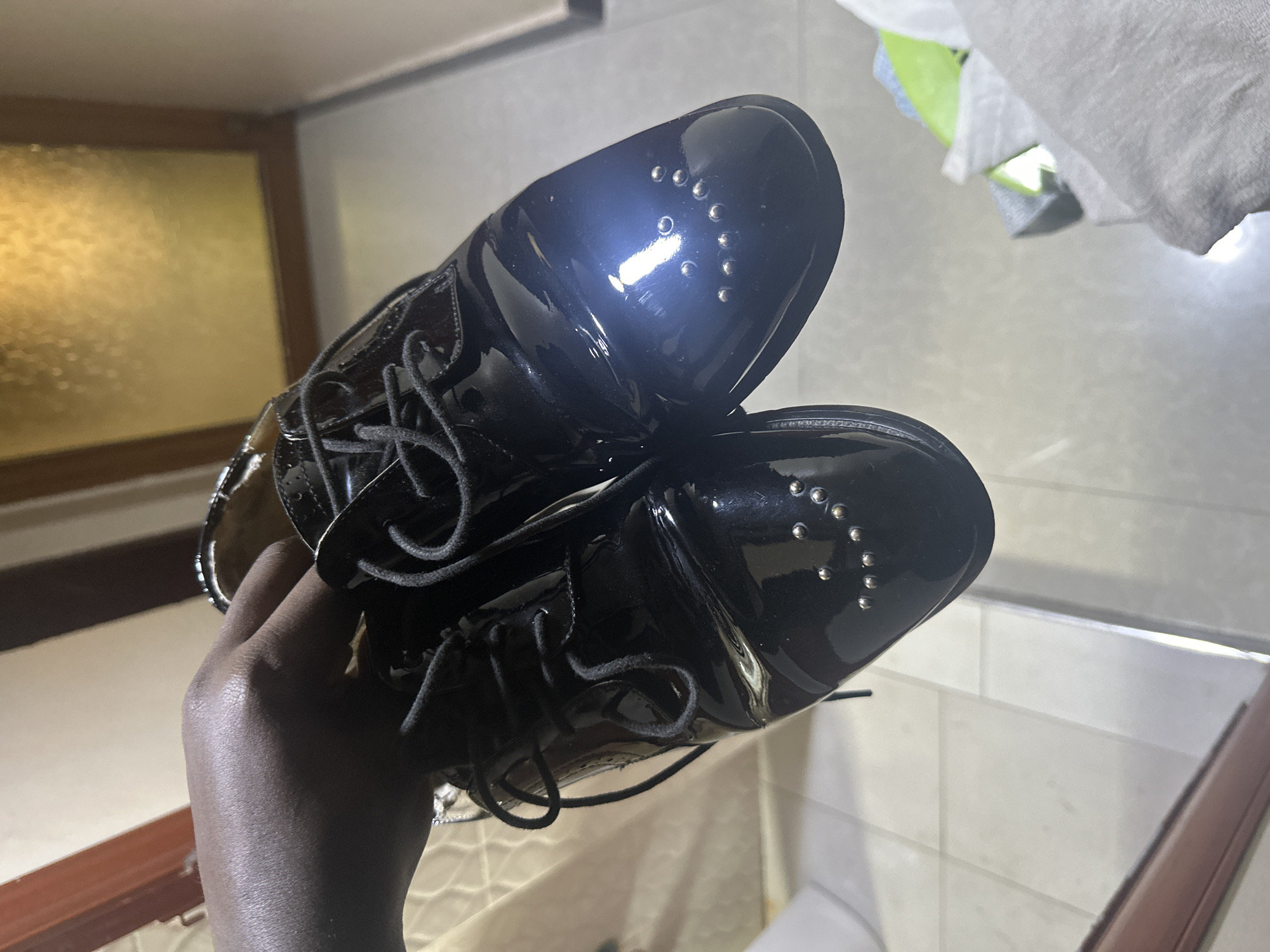 Studded patent leather oxfords on display in Dar es Salaam