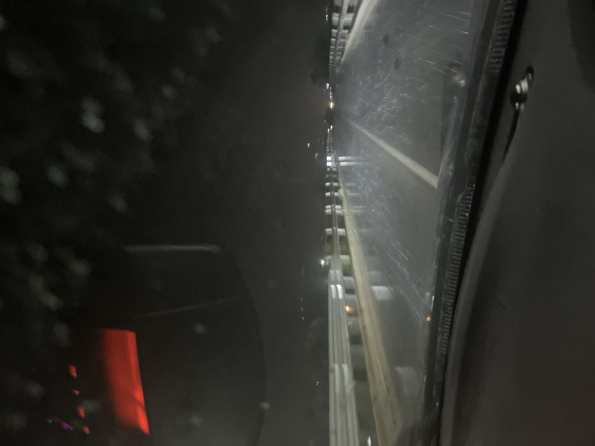 Driver navigates rainy night streets in Blagoevgrad, Bulgaria