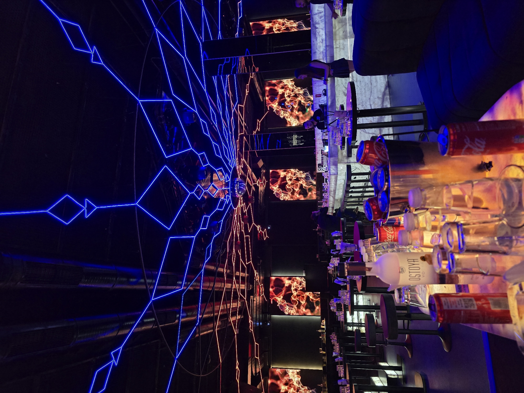 Evening bar scene captured in Sofia featuring neon displays