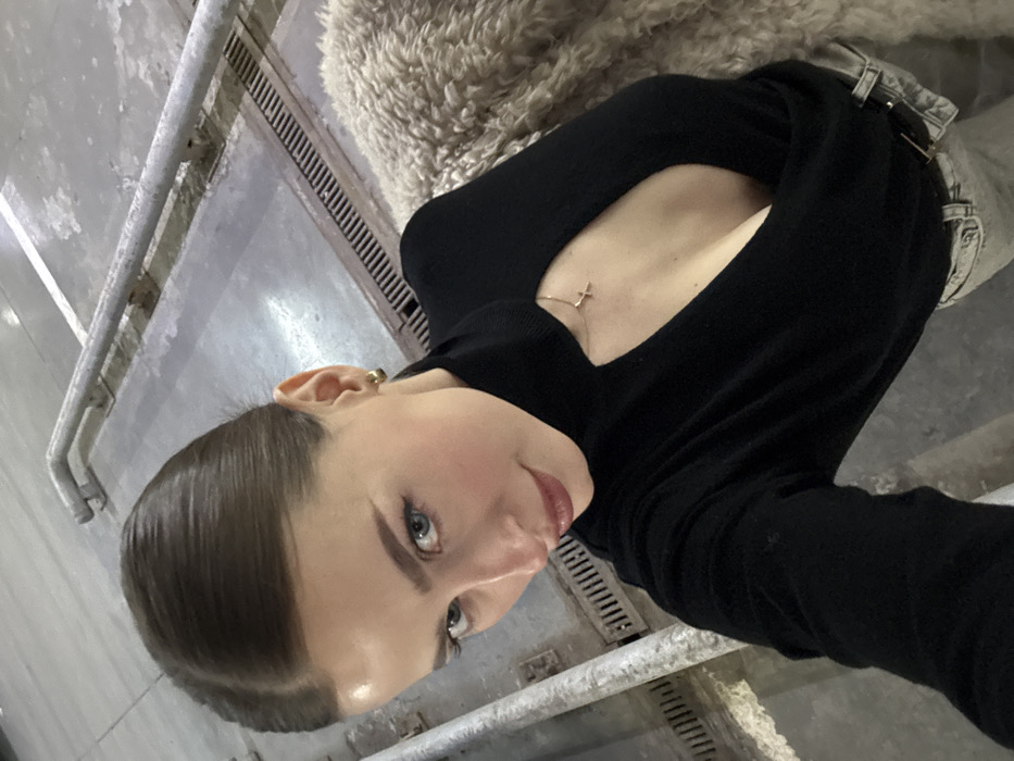 Woman takes selfie in concrete structure in Krasnoyarsk