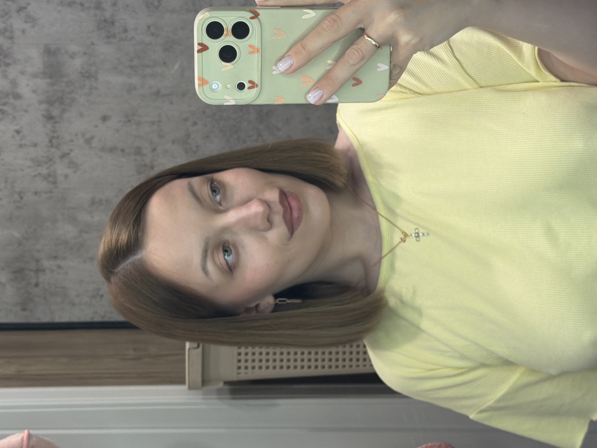 Woman takes selfie with decorated phone in Reshetnikovo