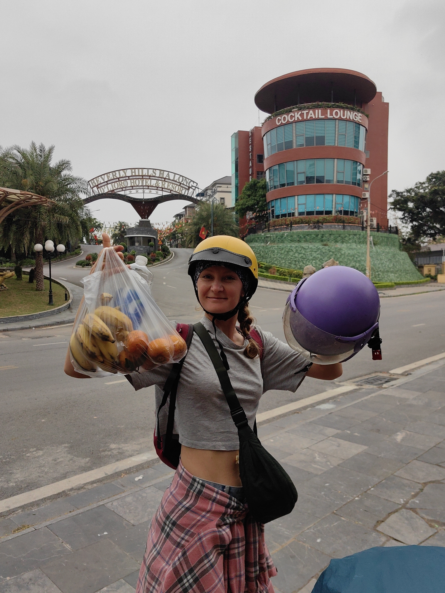 Woman poses playfully on Vietnam sidewalk during early morning