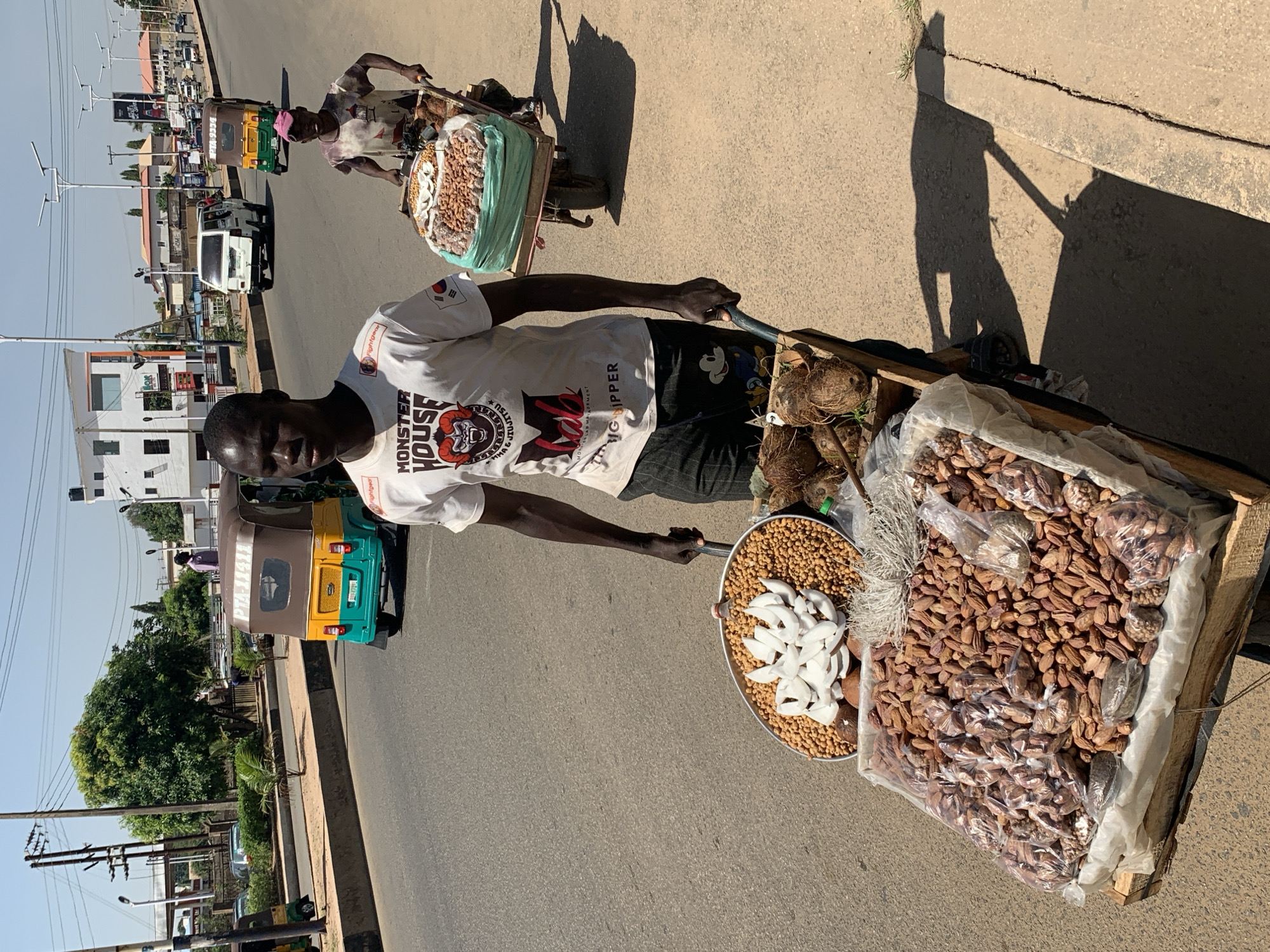 Daily street life documented across Jos, Nigeria during sunny morning