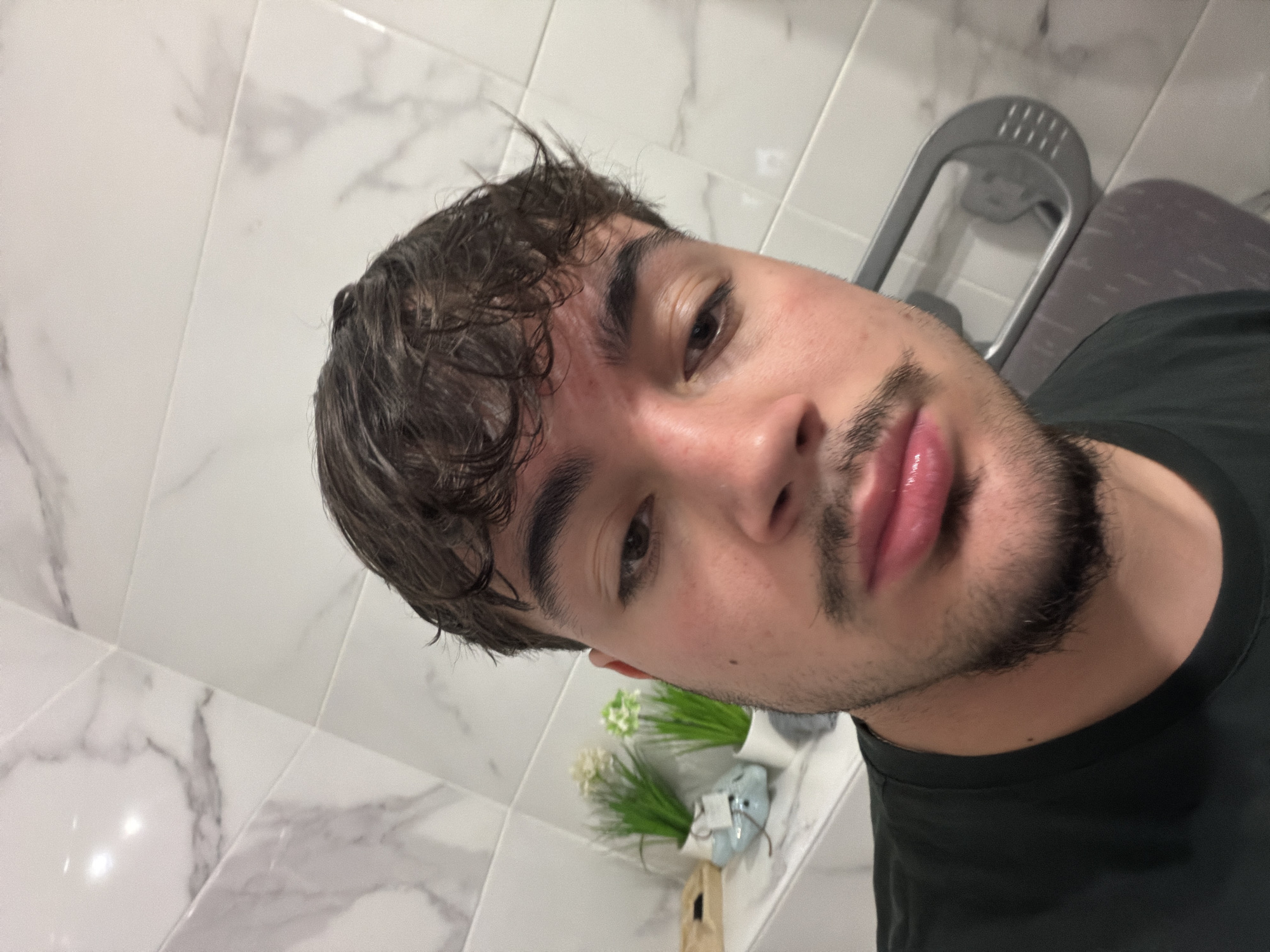 Young man takes indoor selfie in Rijeka, Croatia