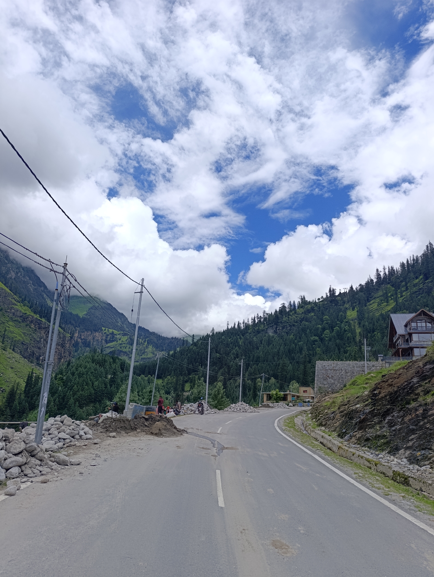 A misty morning in Kothi's mountain village, roads, and wildflowers