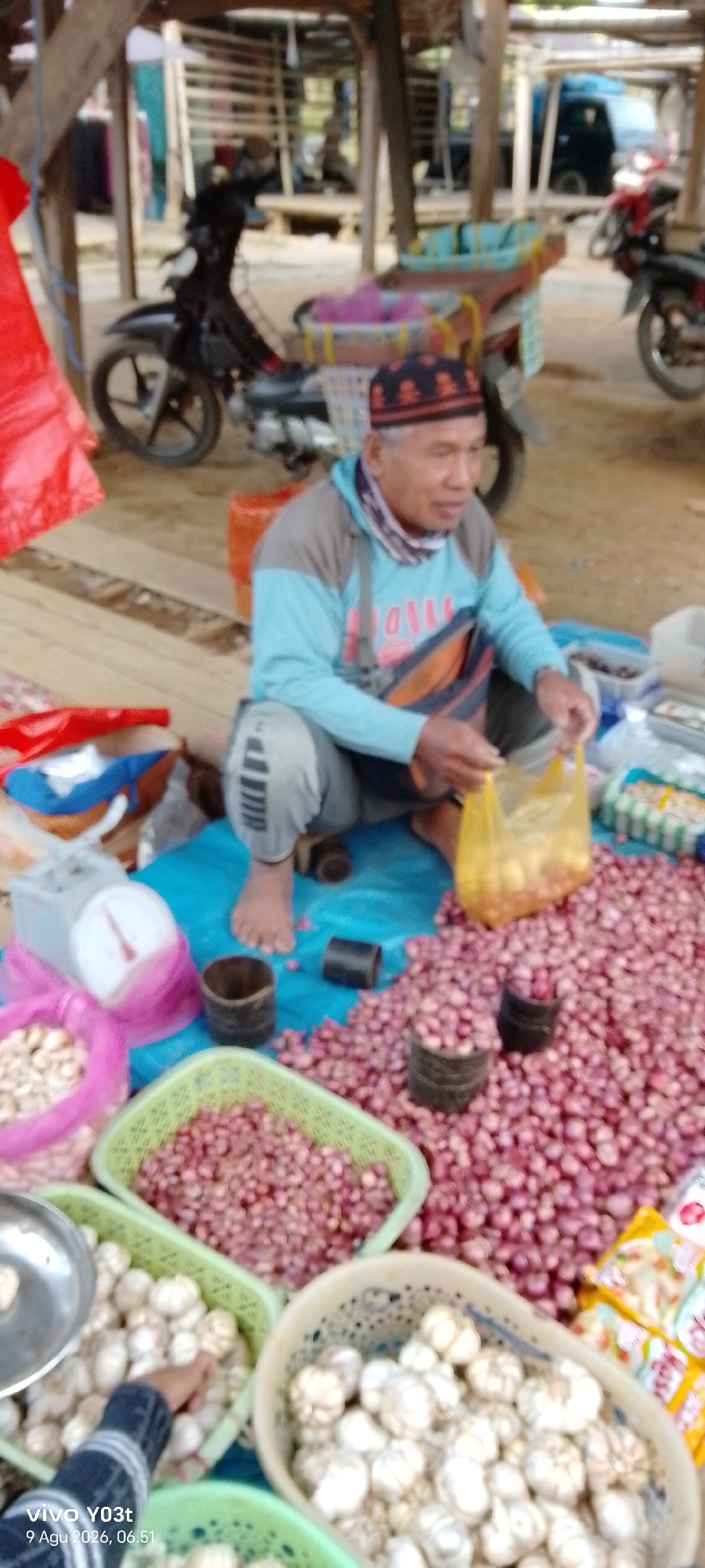Outdoor market day in Palosilae, vendors selling food and produce