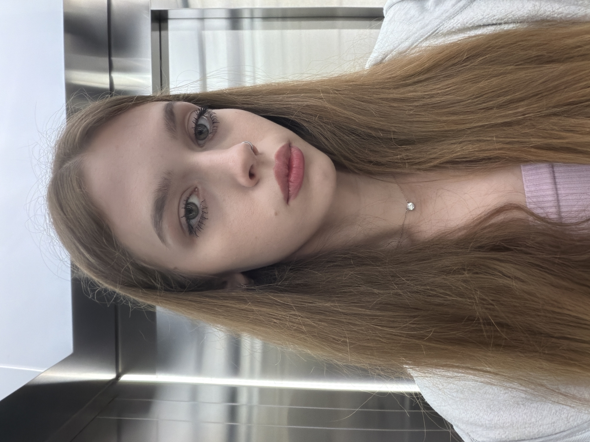 Selfie series across elevator and restroom mirrors, same outfit throughout
