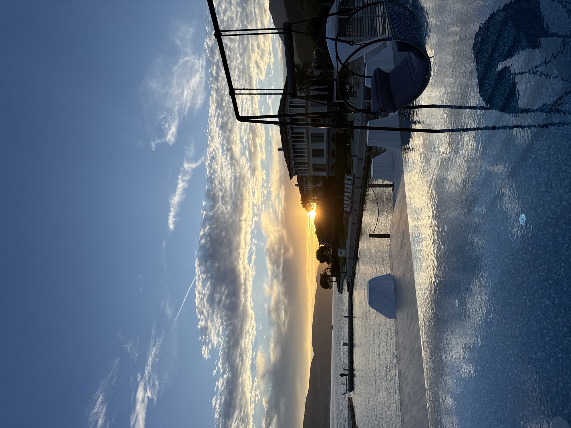 Woman enjoys sunset by bay in Kumbor, Montenegro