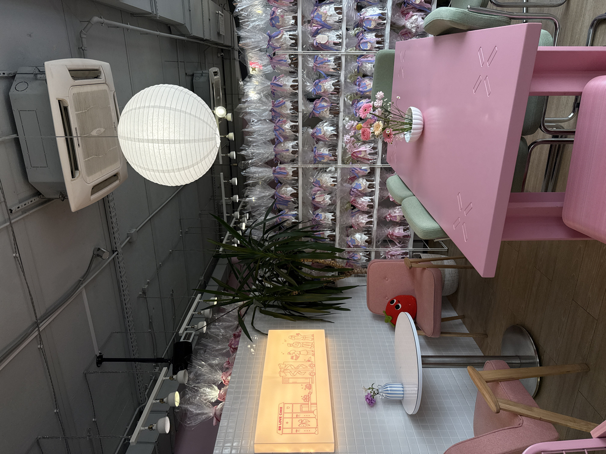 Moscow dessert shop interior captured with industrial decor, paper lanterns