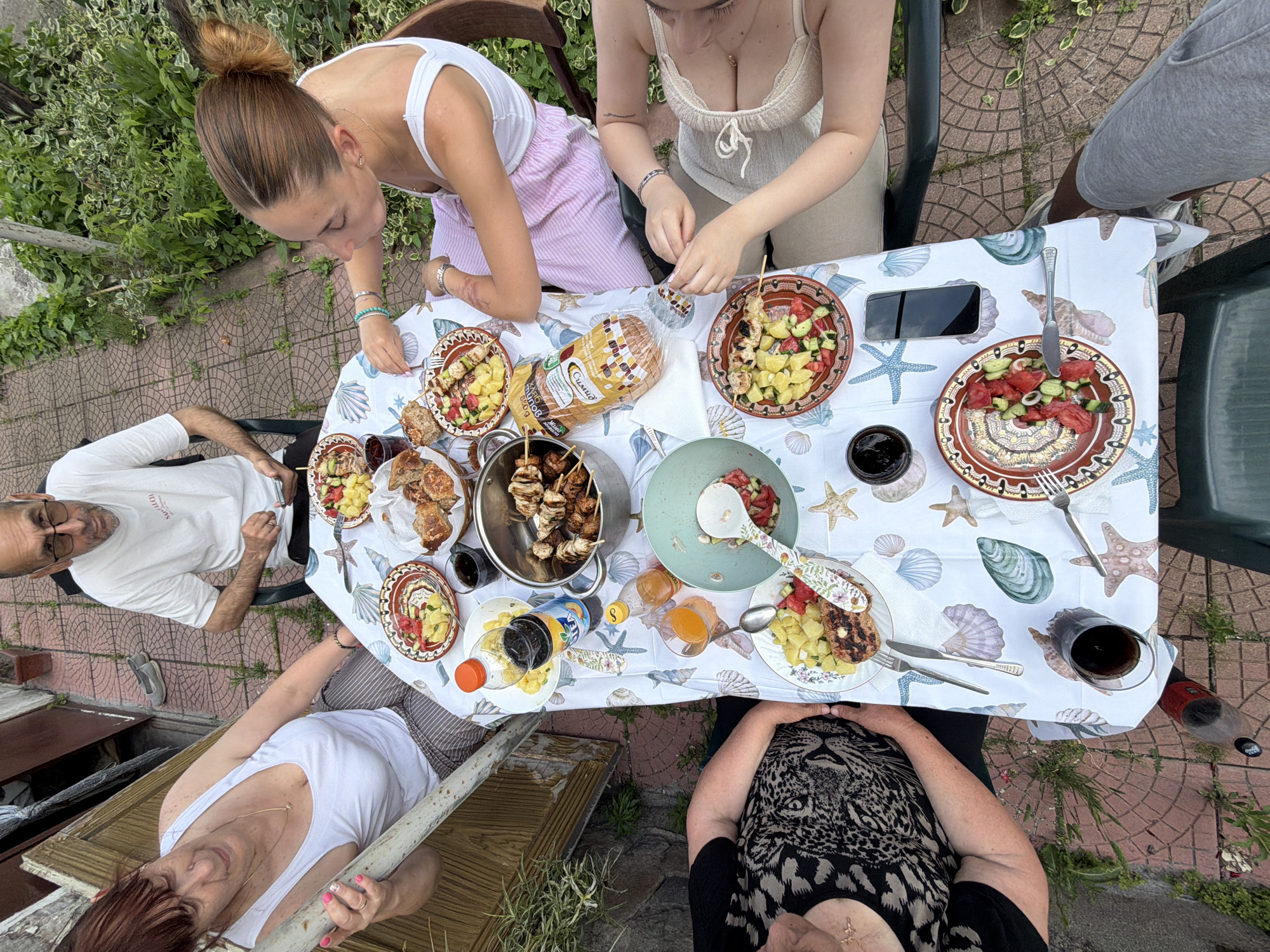 Outdoor lunch gathering of five people in Krumovo, Bulgaria
