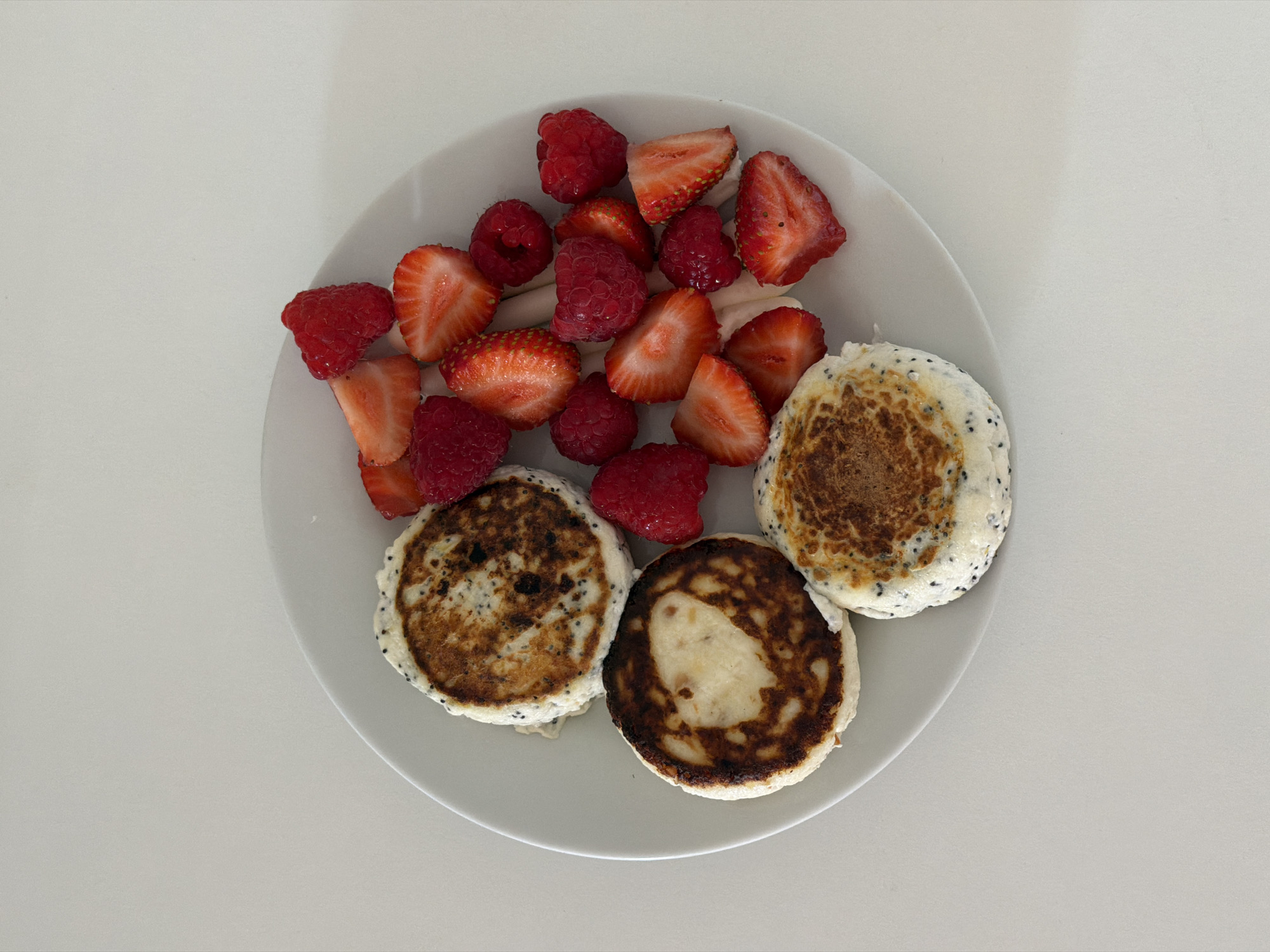 Morning breakfast documented in Tel Aviv features pancakes with berries
