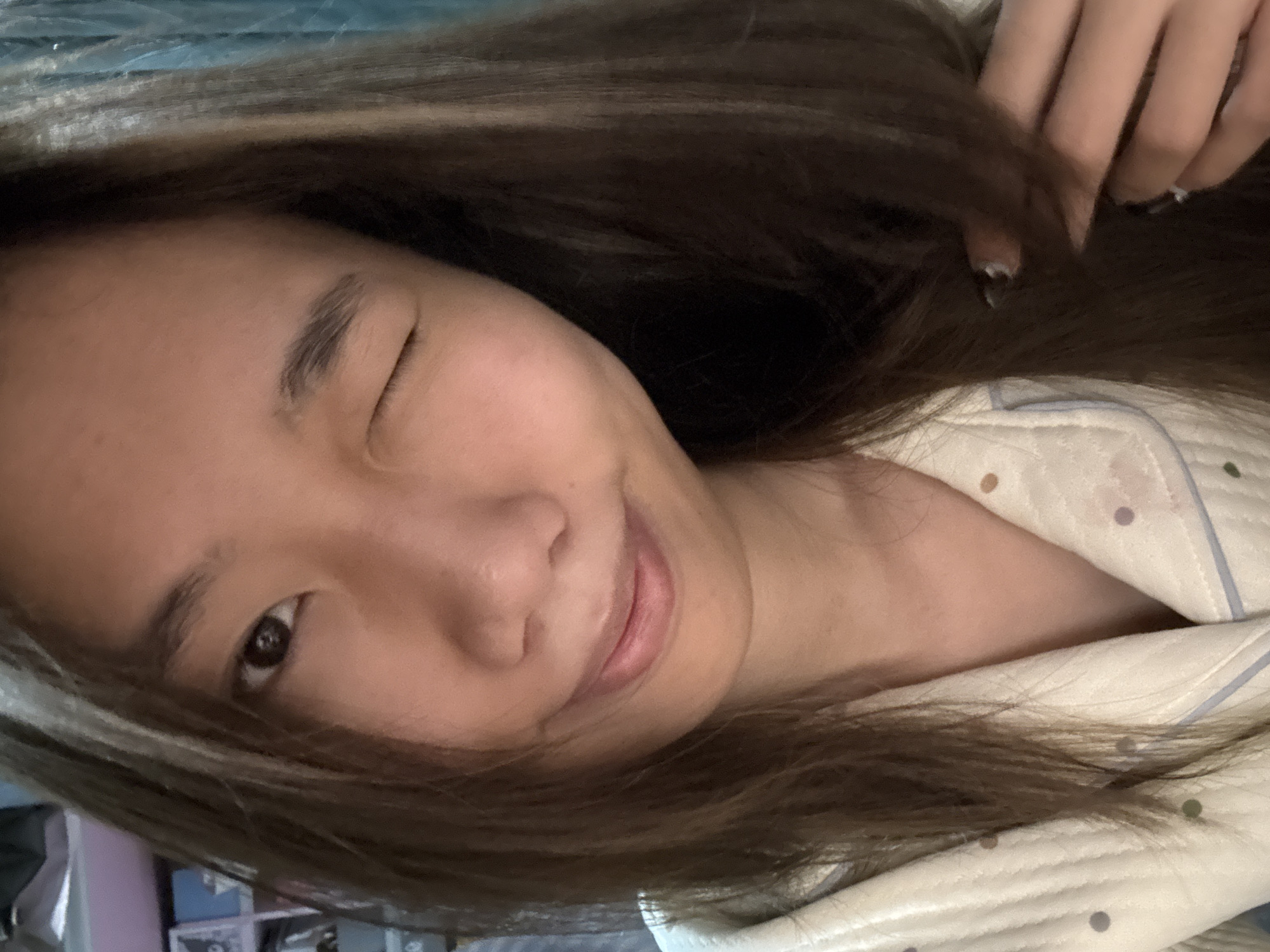Woman takes casual selfies in pajamas at home
