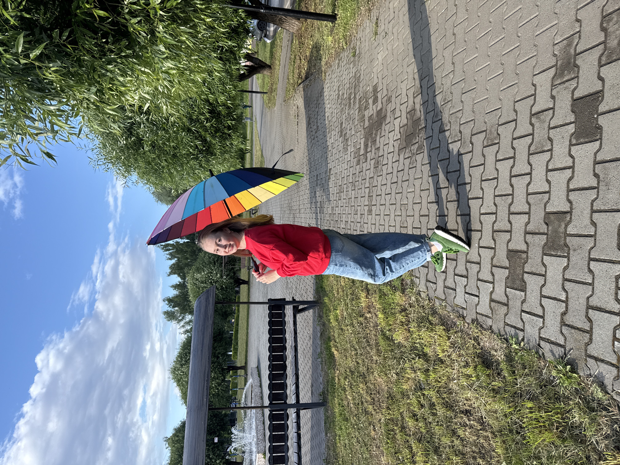 Rainy day out: makeup, pigeons, and a rainbow umbrella