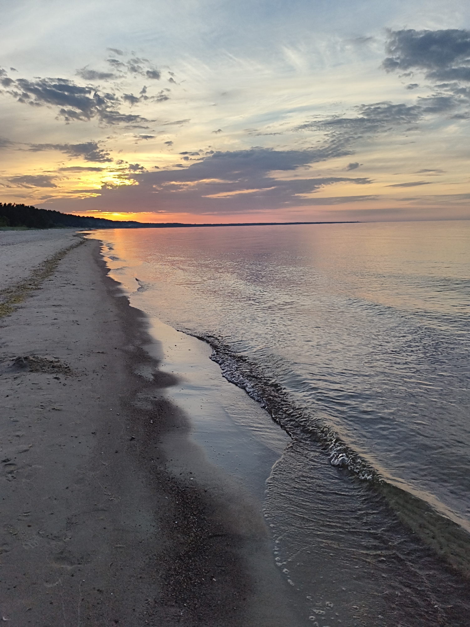 Baltic sunset evening on Apšuciems beach, Latvia