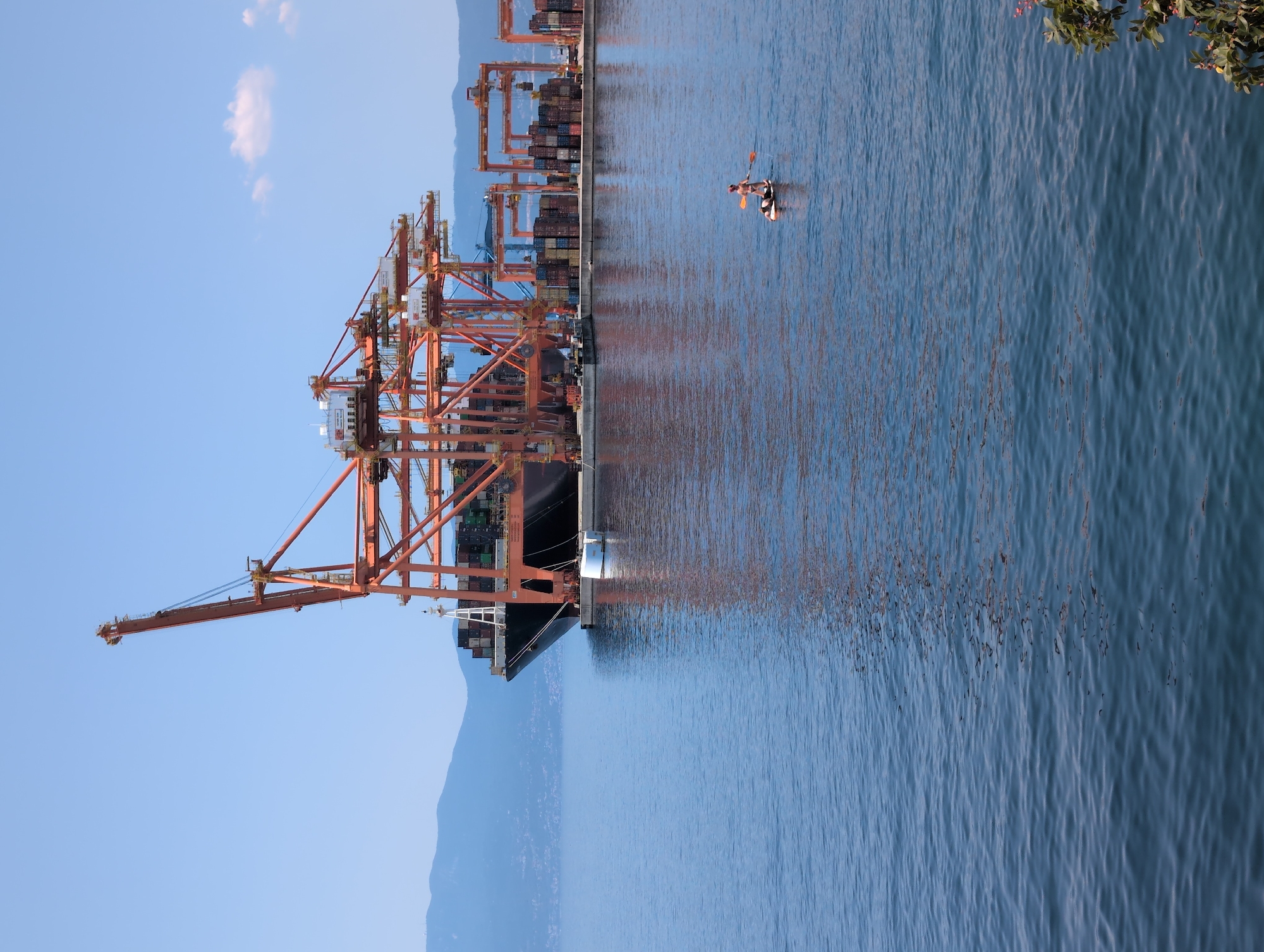 Rijeka's beach and port coexist on a busy summer morning