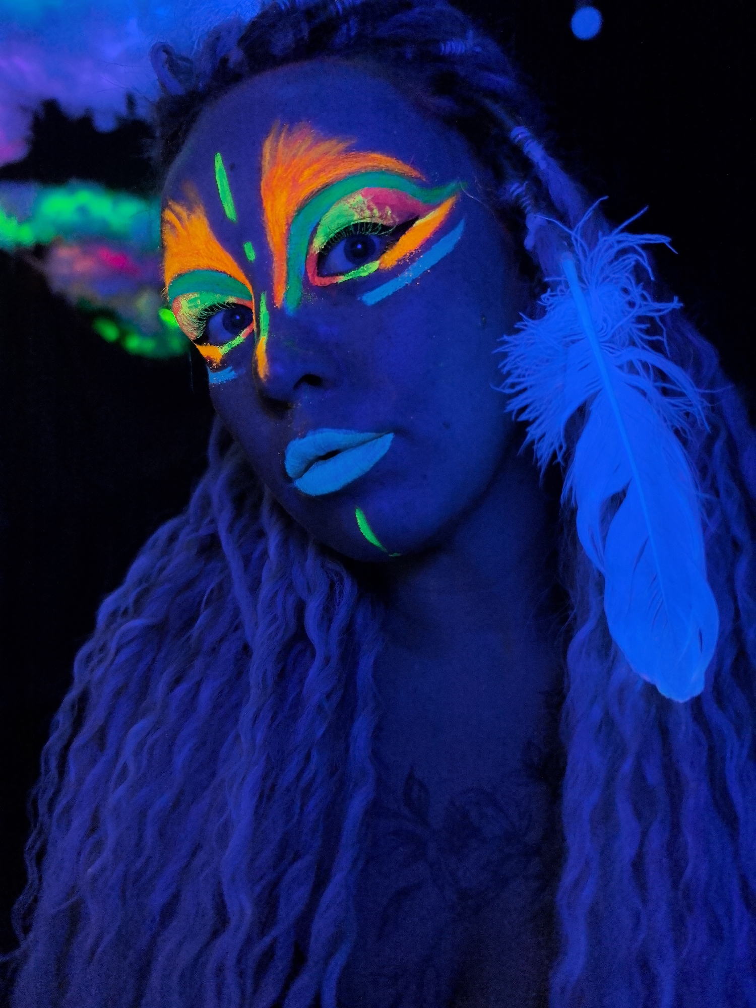 Fluorescent body art and pet portraits captured in Noviy