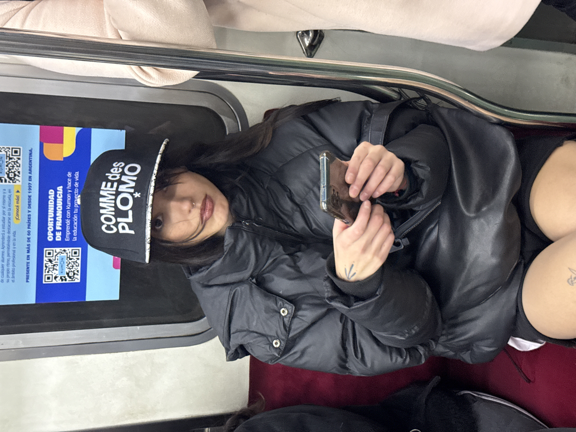 Commuter in puffer jacket rides Buenos Aires subway