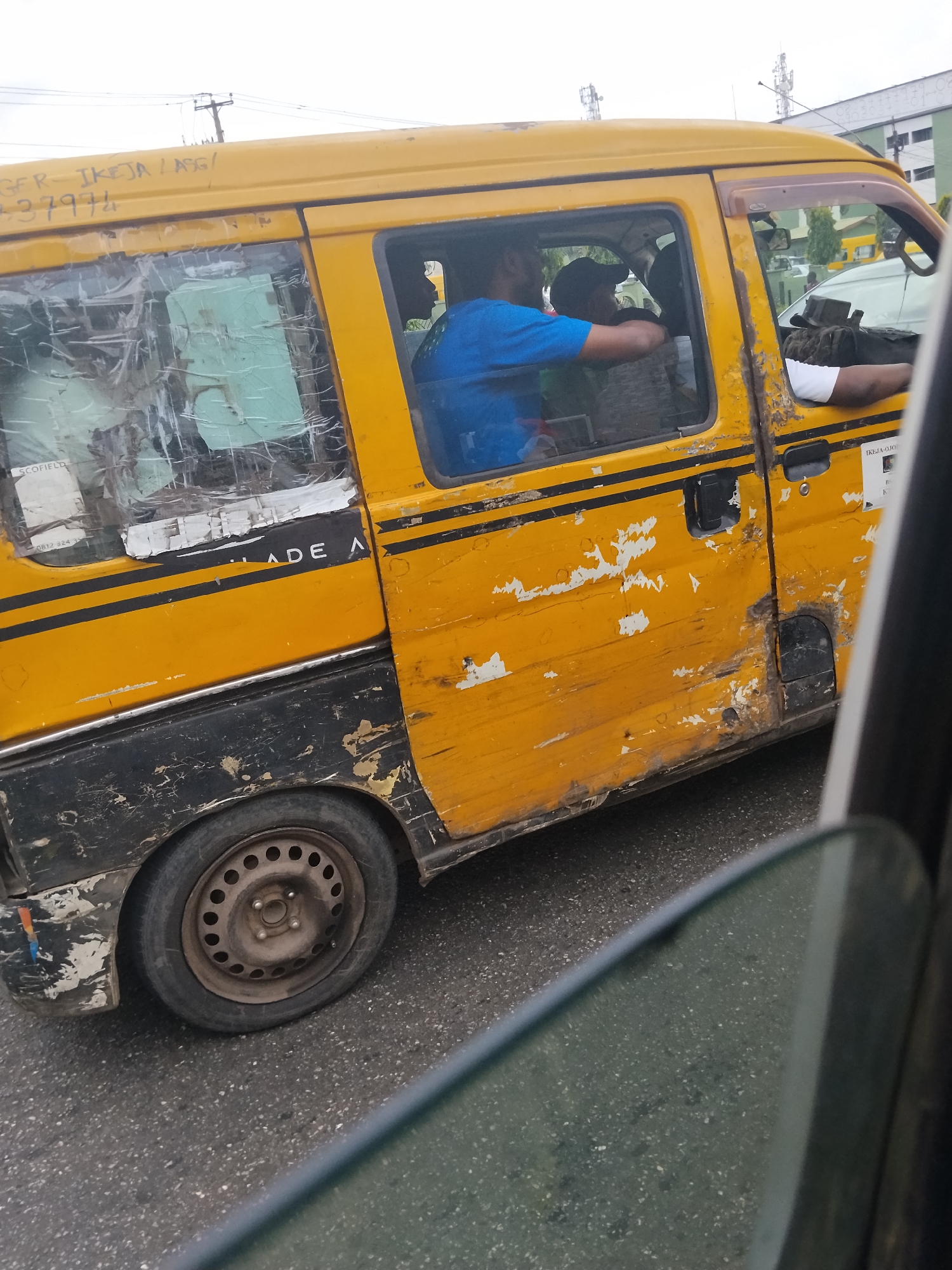 Street life and vehicle journey documented in Ikeja Nigeria