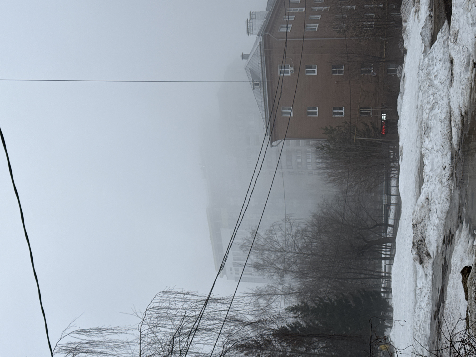 Fog blankets Kazan street, obscuring buildings