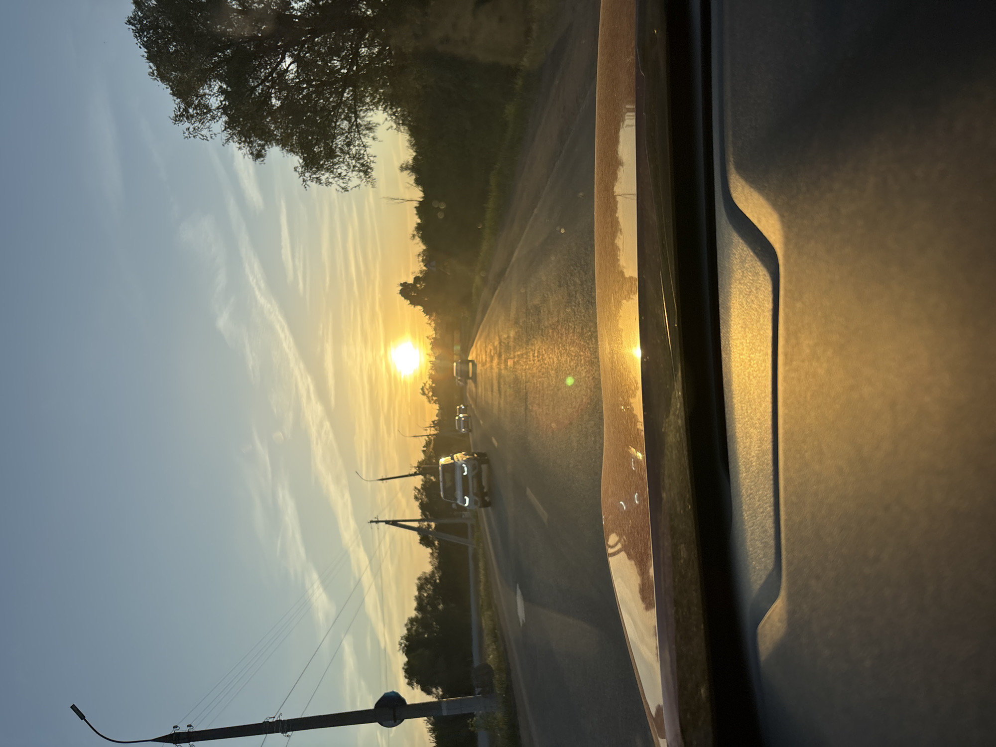 Sunset viewed from vehicle near Kabanikha, Russia
