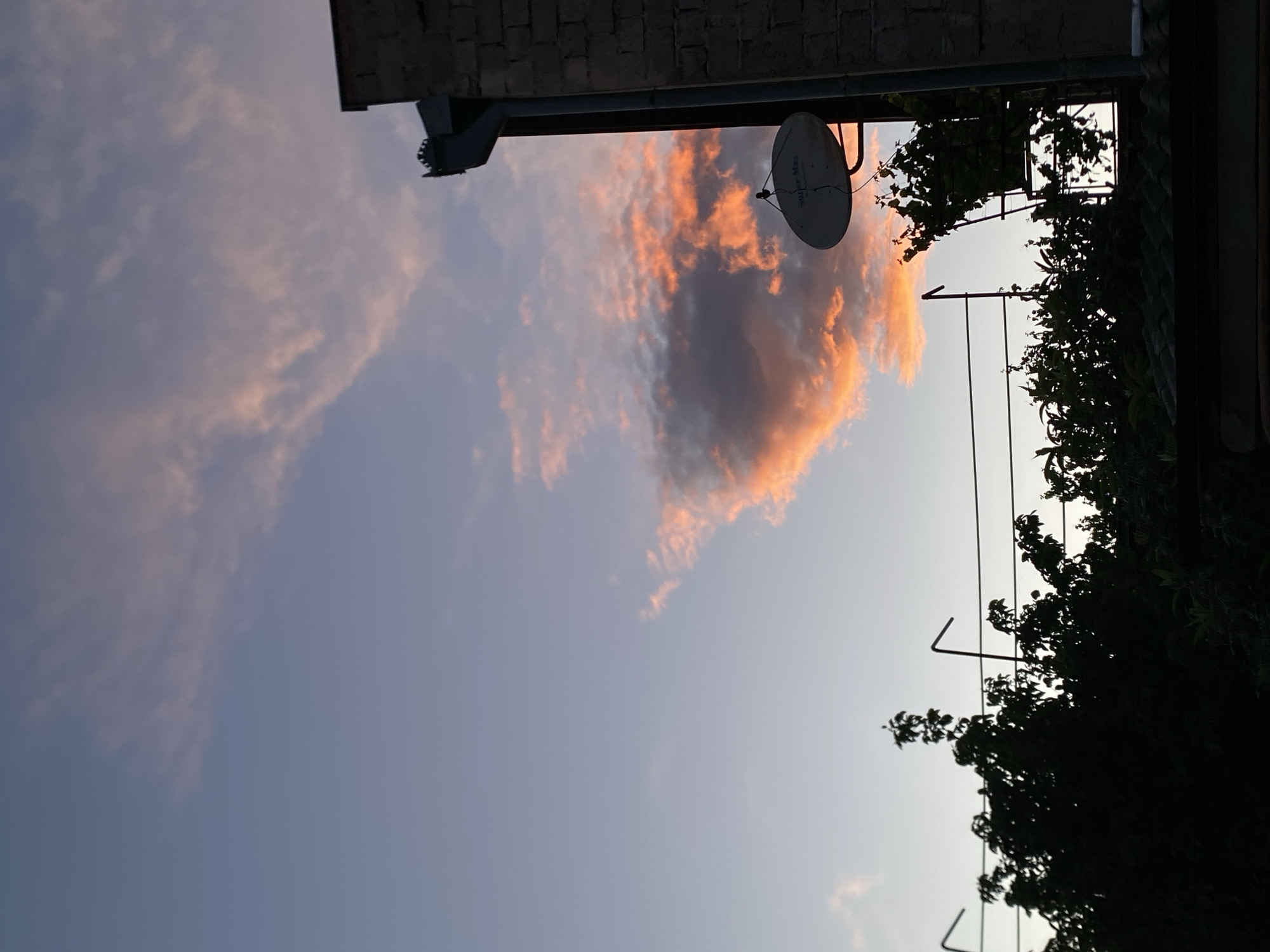 Sunset photographed over residential Tbilisi neighborhood