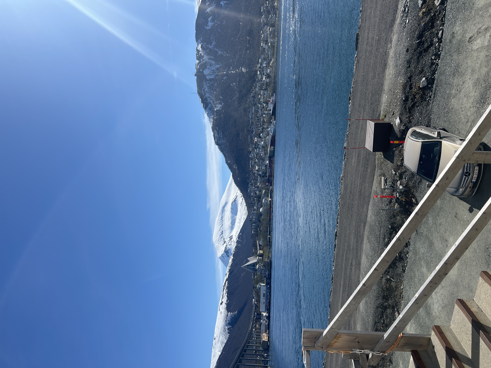 Clear skies frame Tromsø's fjord and snowy peaks