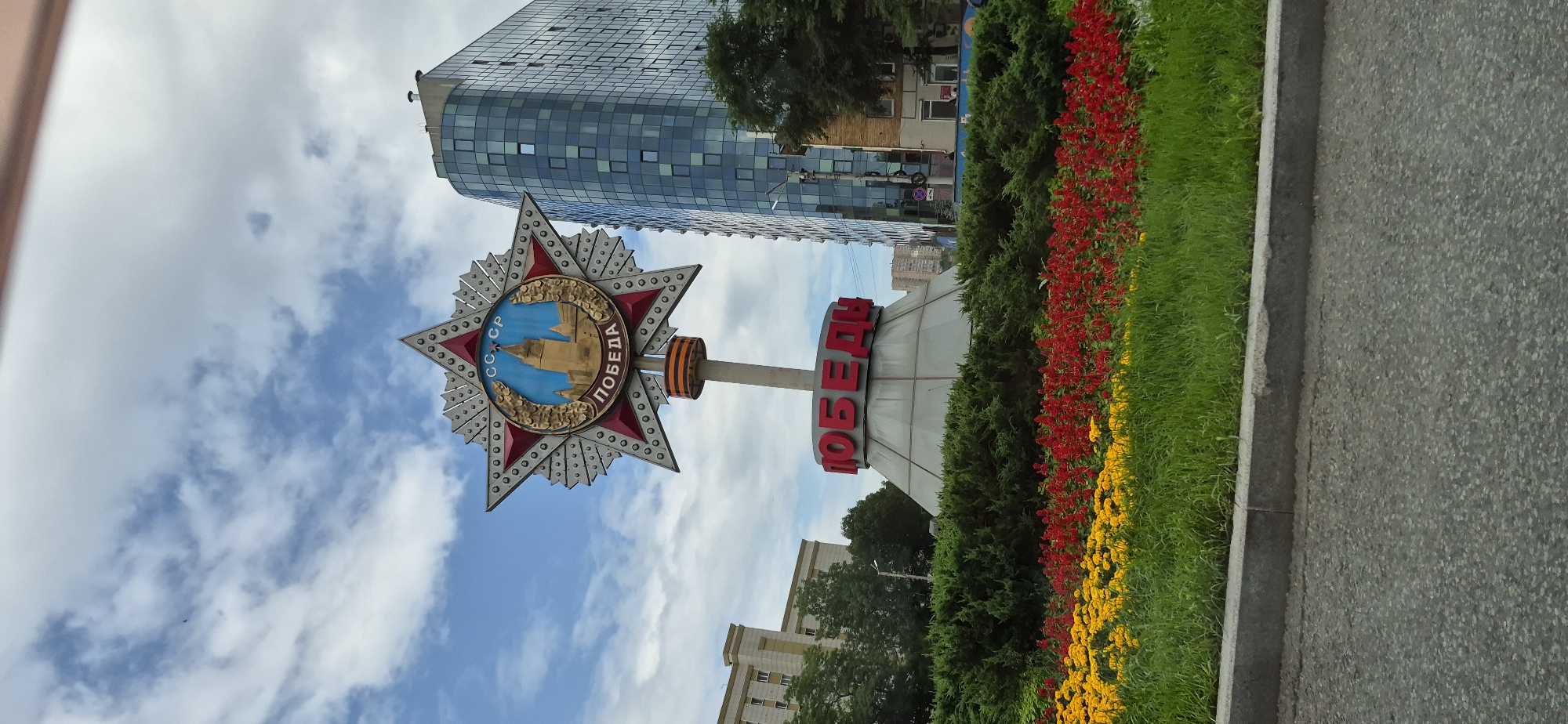 Driving through Vladivostok past monuments, trolleybuses, and city streets