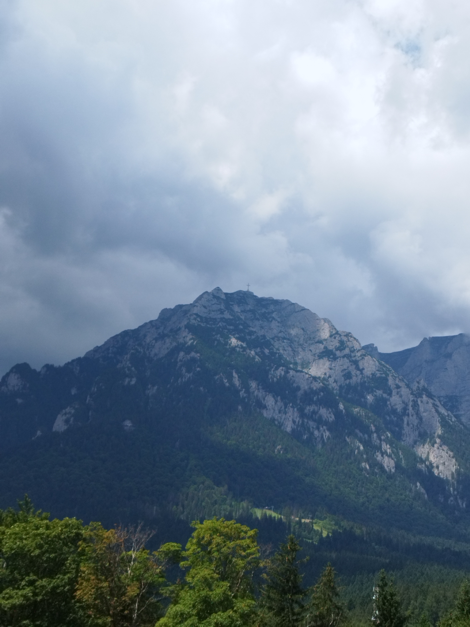 Morning in Bușteni: Caraiman Cross, Bucegi peaks, and castle grounds