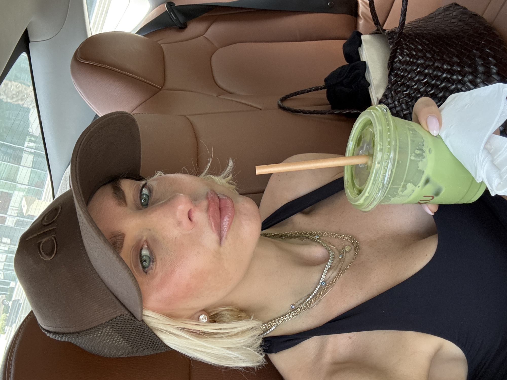 Woman enjoys matcha latte from OTAKU cafe in Dubai