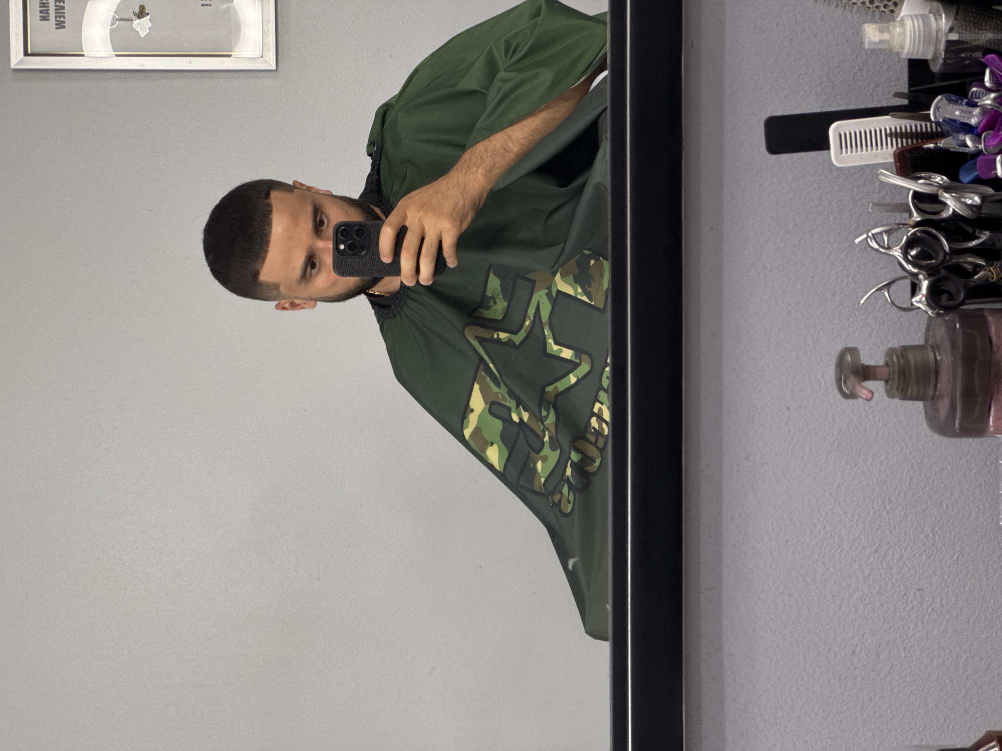 Customer documents haircut experience at Patong barbershop with selfies