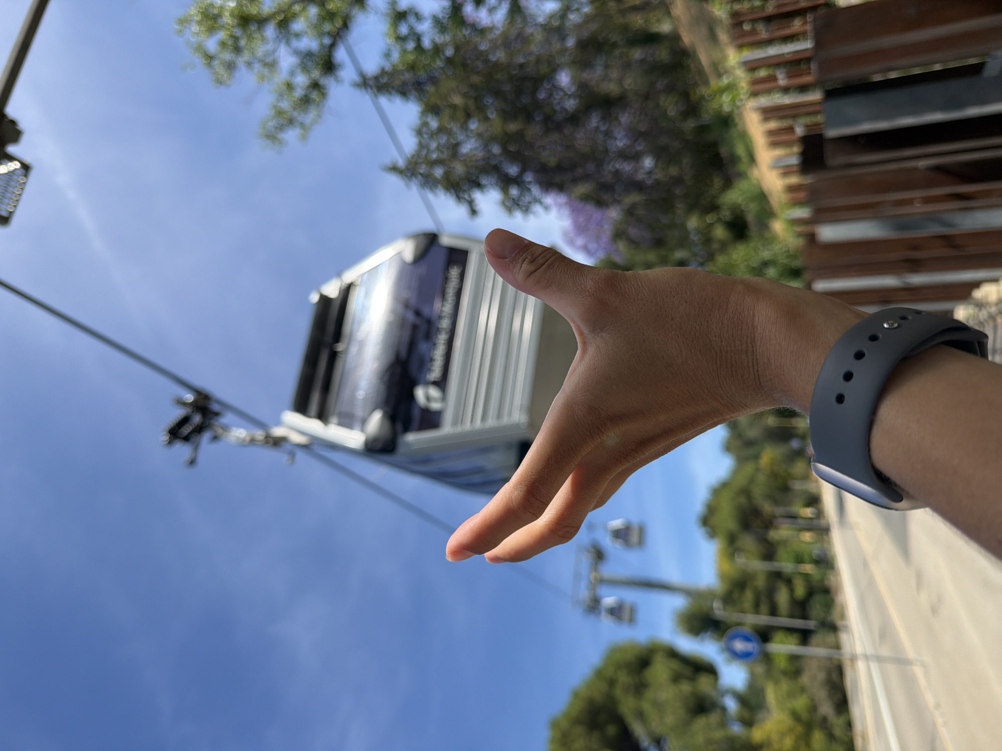 Tourist documents Barcelona cable car tour, city landmarks