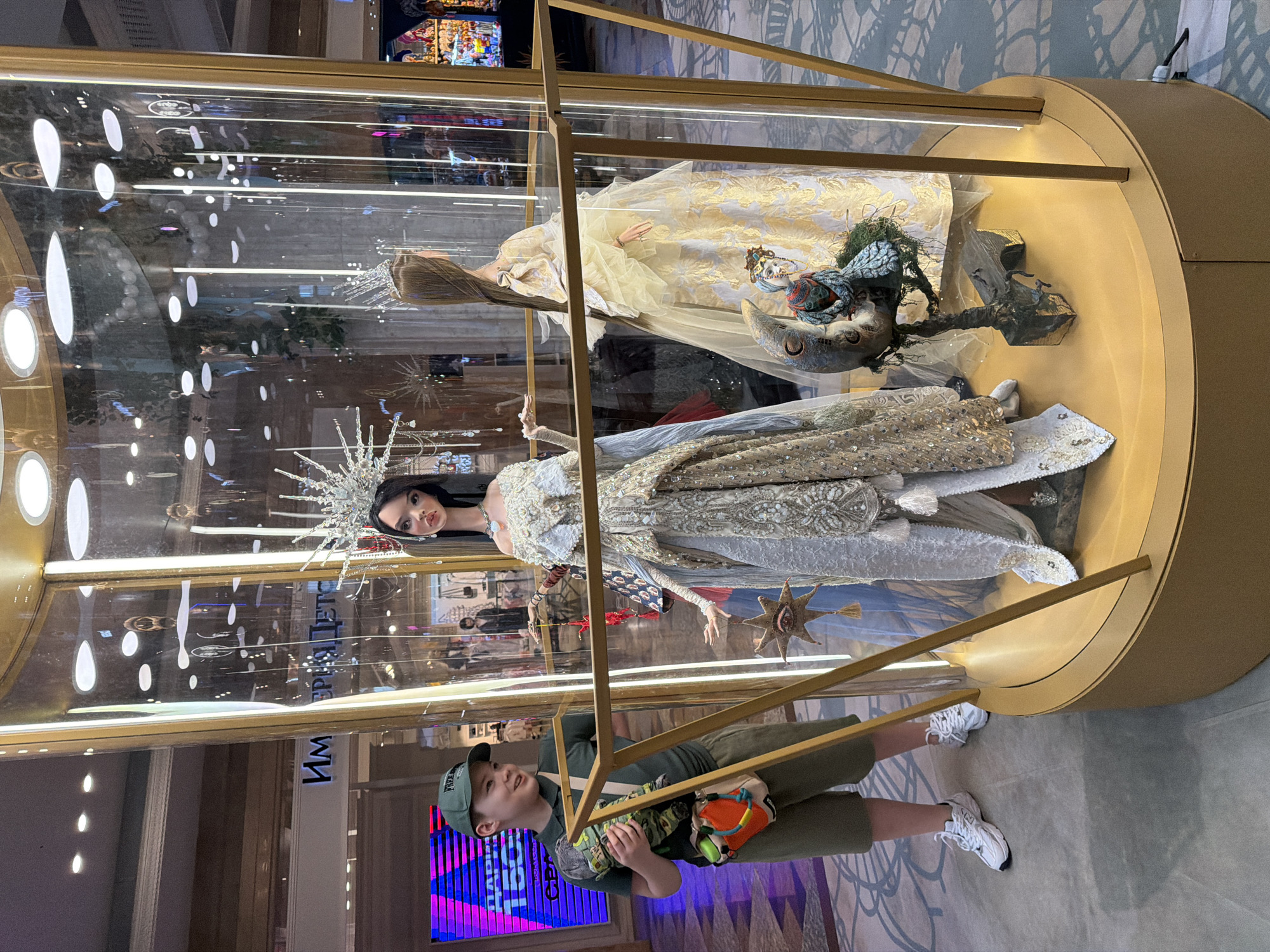 Boy explores puppet displays at Moscow's GUM department store